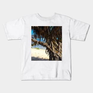 Tree trunks at Watu Karung sand beach Kids T-Shirt